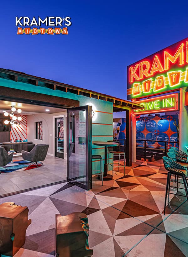 Kramer’s Muv Town rooftop bar with neon signage and modern seating, offering a trendy nightlife scene in Mercer City. Perfect for cocktails and socializing.