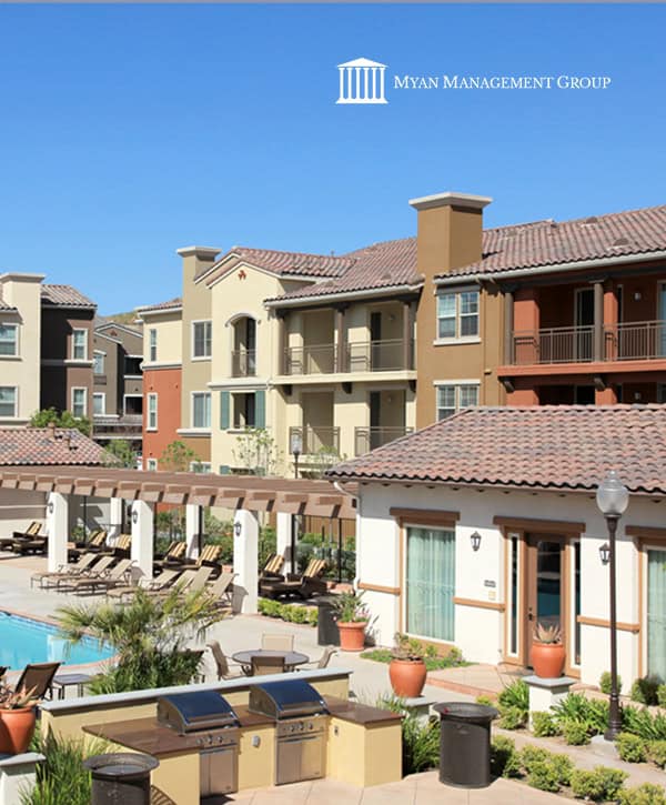 Luxurious apartment complex with outdoor pool and lounge area, surrounded by landscaped gardens, perfect for modern urban living.